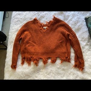 Distressed copper sweater